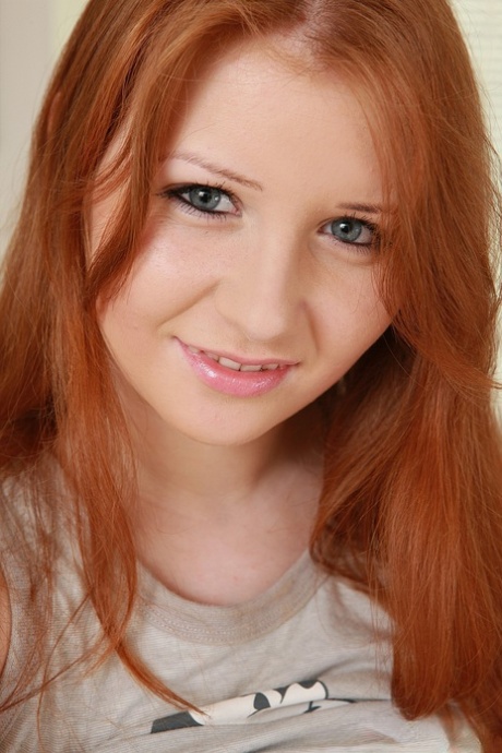 Innocent redhead Jess shows her big tits and masturbates with a dildo