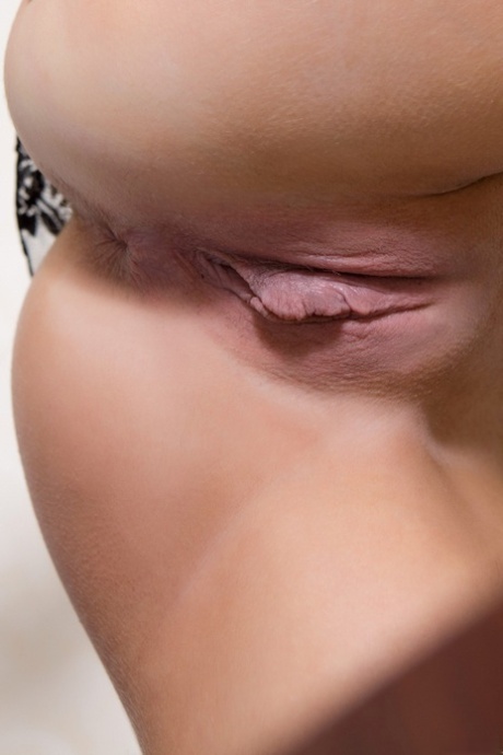 Beautiful teen Viki G showing off her delicious clit in white stockings