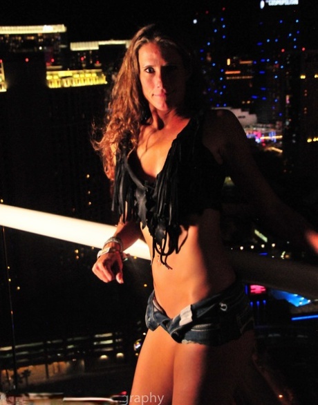All-natural mature brunette Sofie Marie flaunts her hot ass on a rooftop