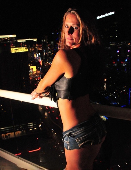 All-natural mature brunette Sofie Marie flaunts her hot ass on a rooftop