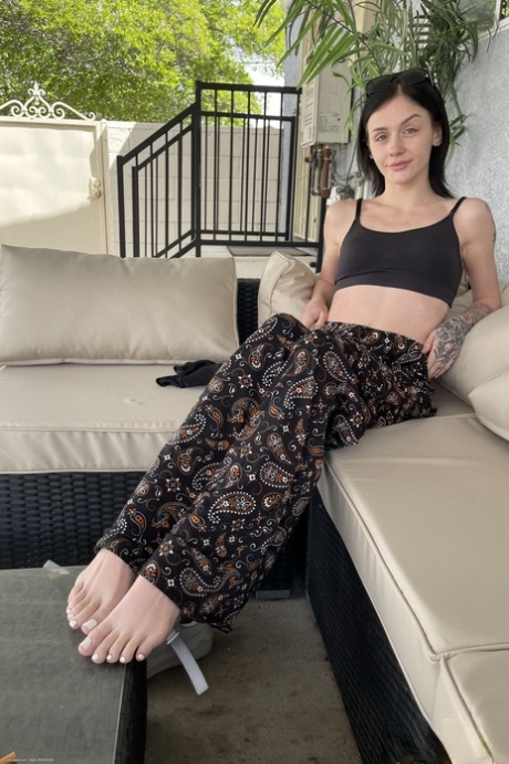 Skinny inked teen Rosalyn Sphinx teases with her feet and yummy pussy