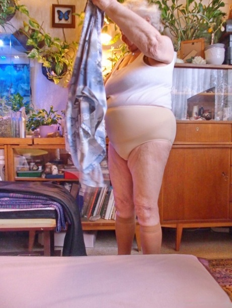 Fat old granny Galfira undresses and poses naked in a solo show